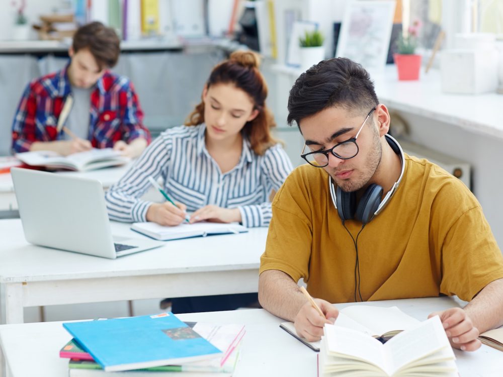 Writing essay Learners writing essay or test at lesson